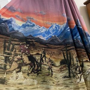 Long skirt with western scene (cowboys and cacti) by Tasha Polizzi.